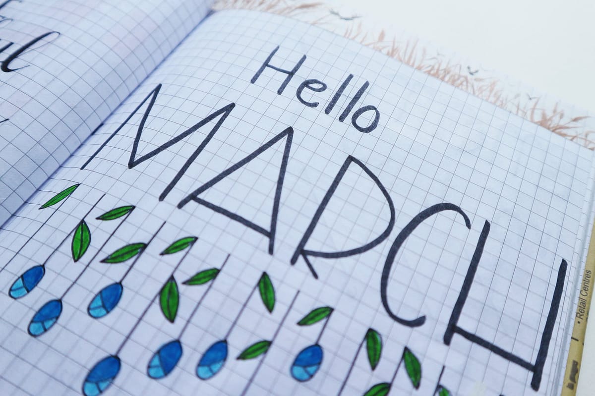 hello march printed paper on white surface